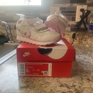 Little girls Nike shoes.